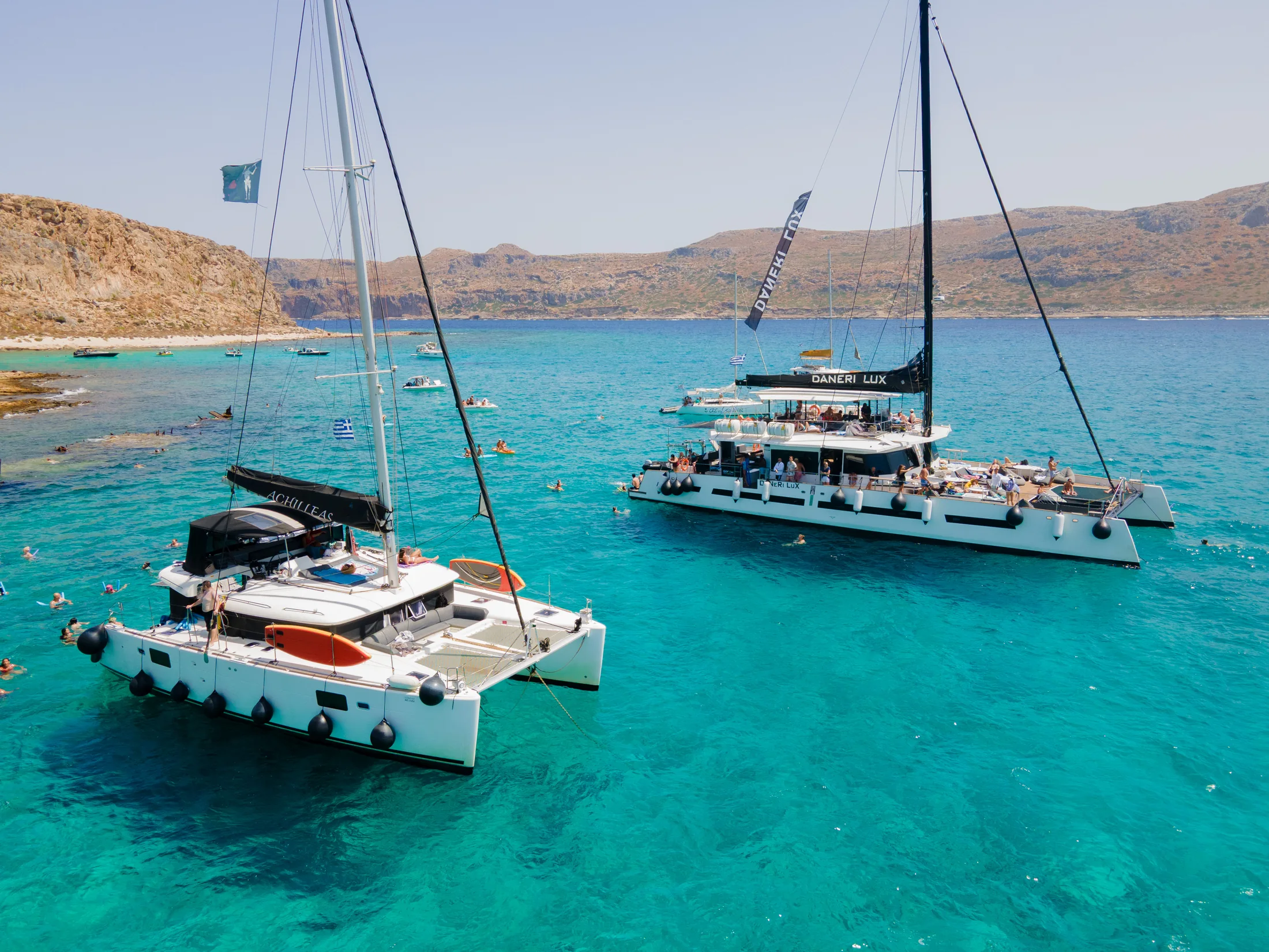 Two DanEri catamarans together in the clear waters near Kissamos